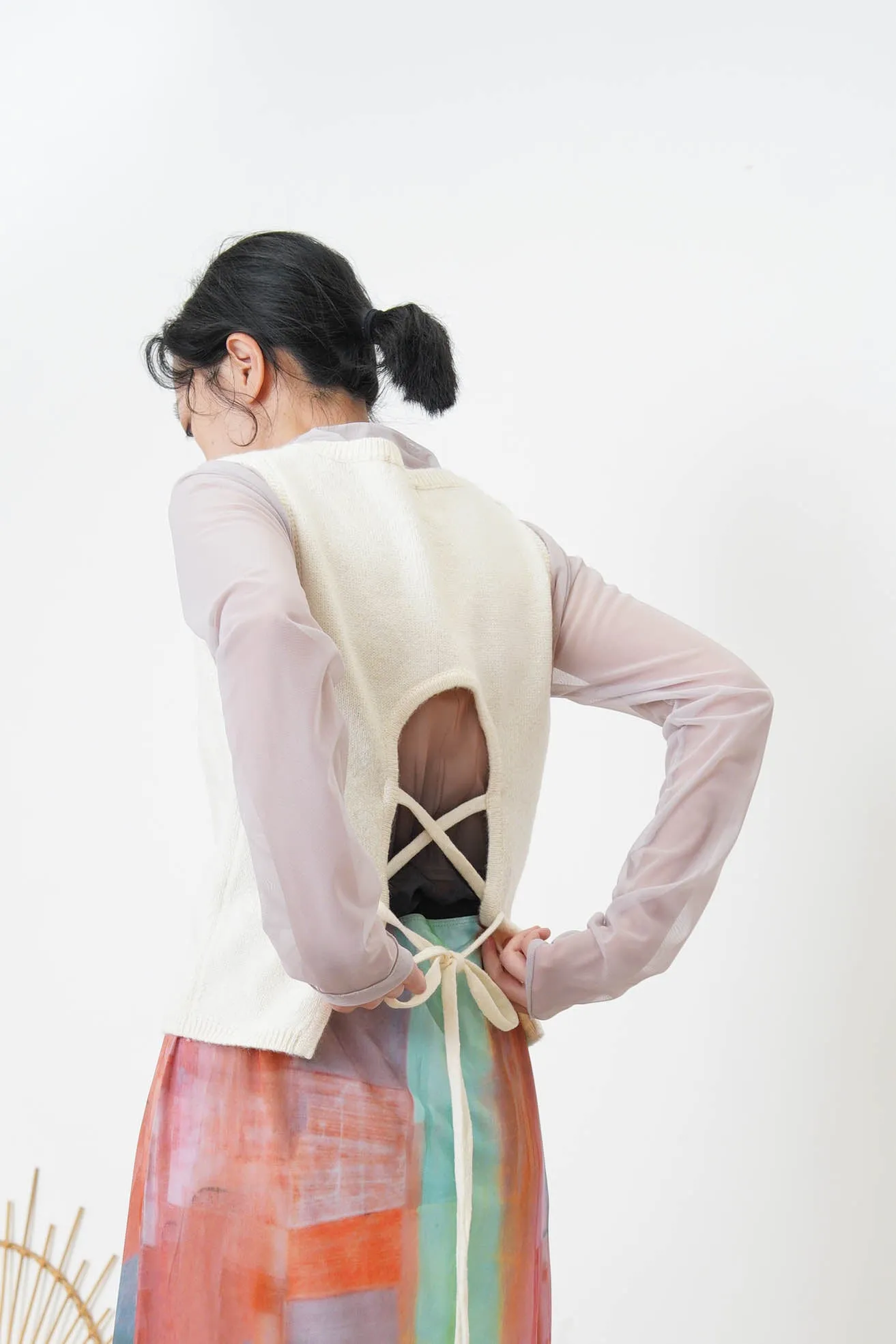 Grey vest w/ strings back details
