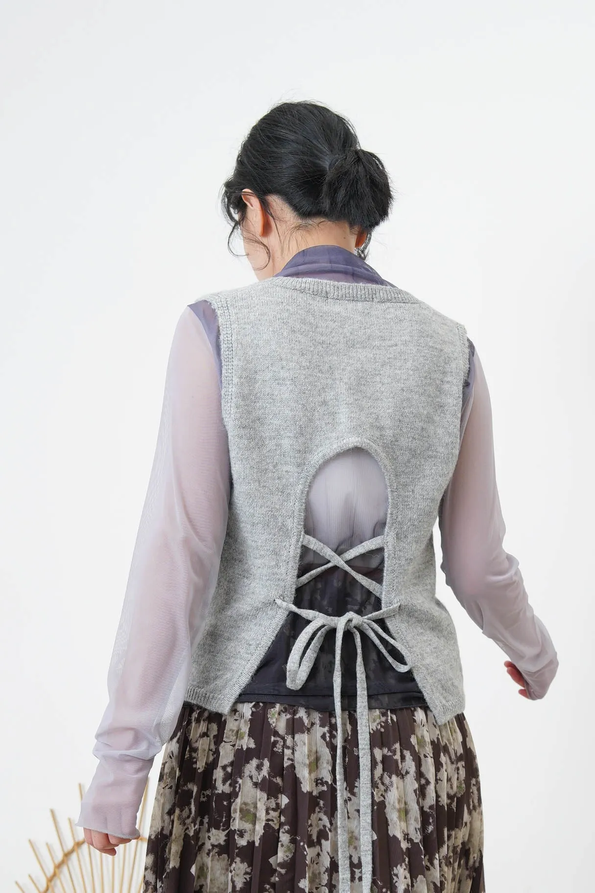 Grey vest w/ strings back details